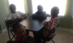 My grand nephews and neice getting ready to eat Thanksgiving dinner.jpg